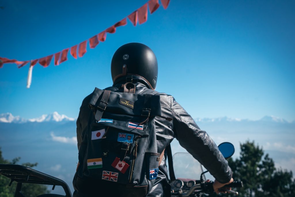 Rob, founder of Gandys, riding a motorbike in Nepal