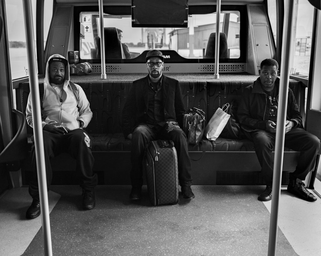 Ghost, RZA and GZA on an airport shuttle bus after disembarking from a private flight
