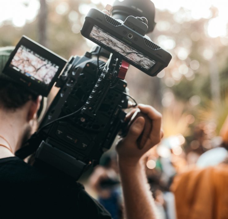 man holding a video camera