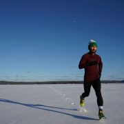 Man running on ice covered land