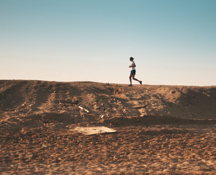 Man running on a dirt road