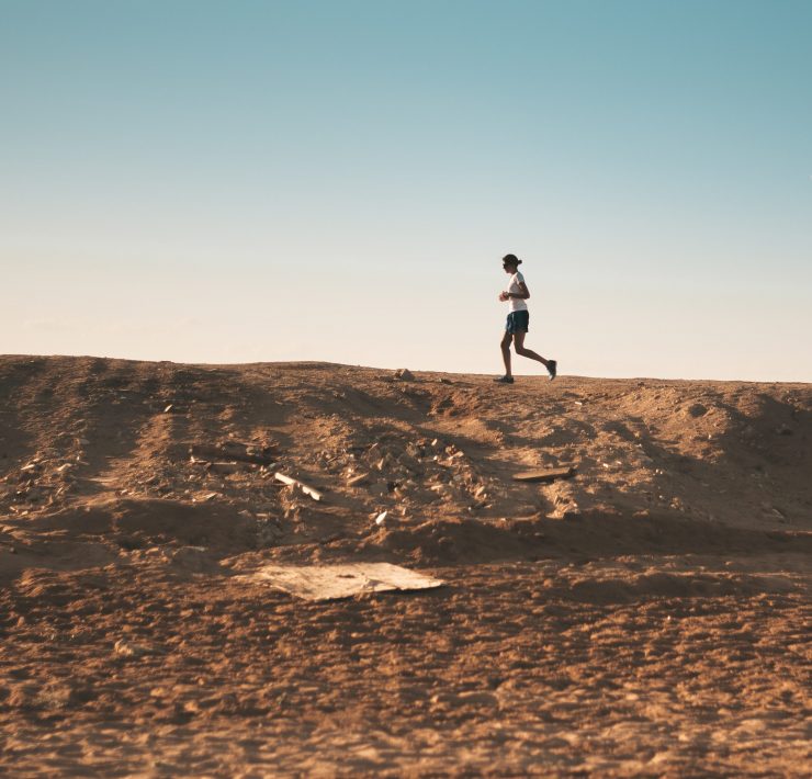 Man running on a dirt road