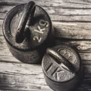 weights on a wooden floor for old man strength 