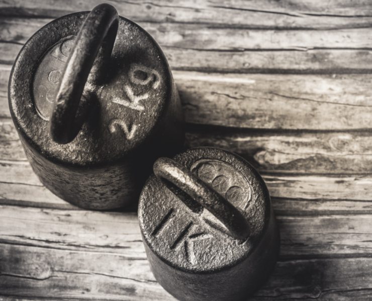 weights on a wooden floor for old man strength 