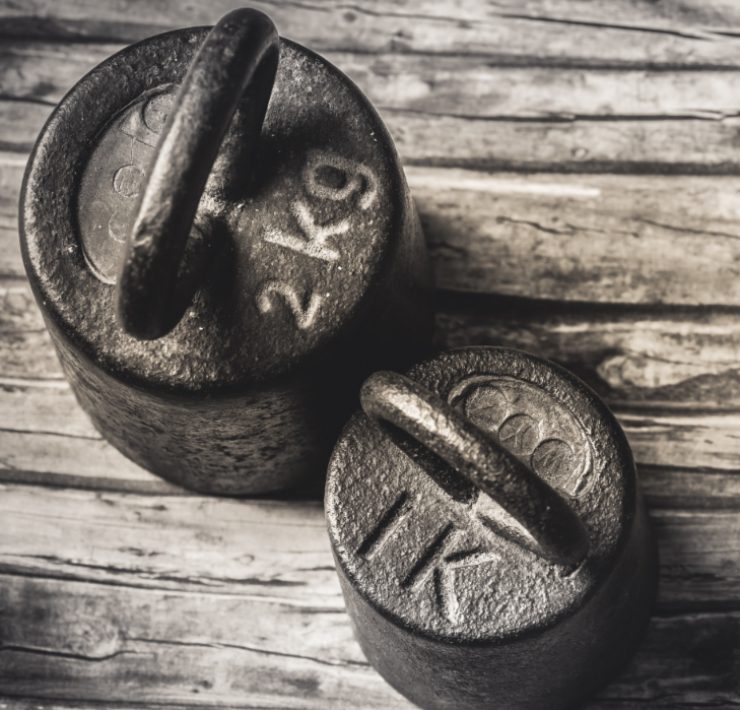 weights on a wooden floor for old man strength 