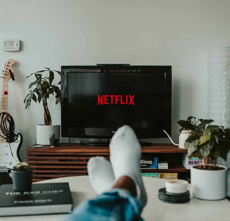 Man watching Netflix from his couch