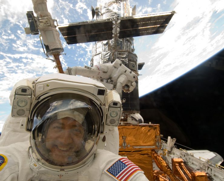 Mike Massimino fixing the Hubble telescope