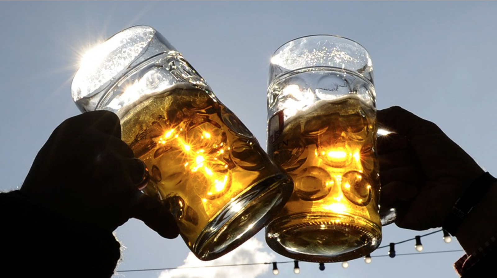 Two pint glasses cheersing