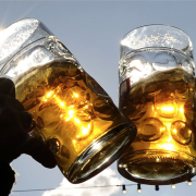 Two pint glasses cheersing