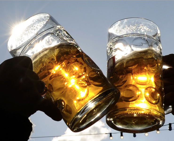 Two pint glasses cheersing