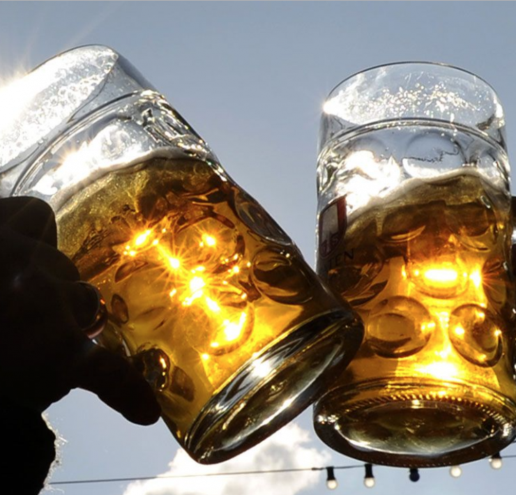 Two pint glasses cheersing