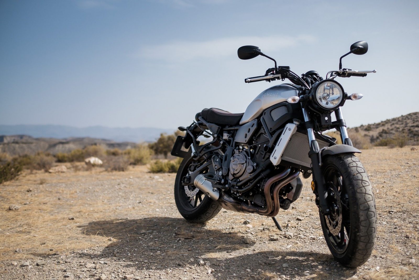 Motorbike parked on a dirt road