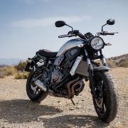 Motorbike parked on a dirt road