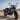 Motorbike parked on a dirt road