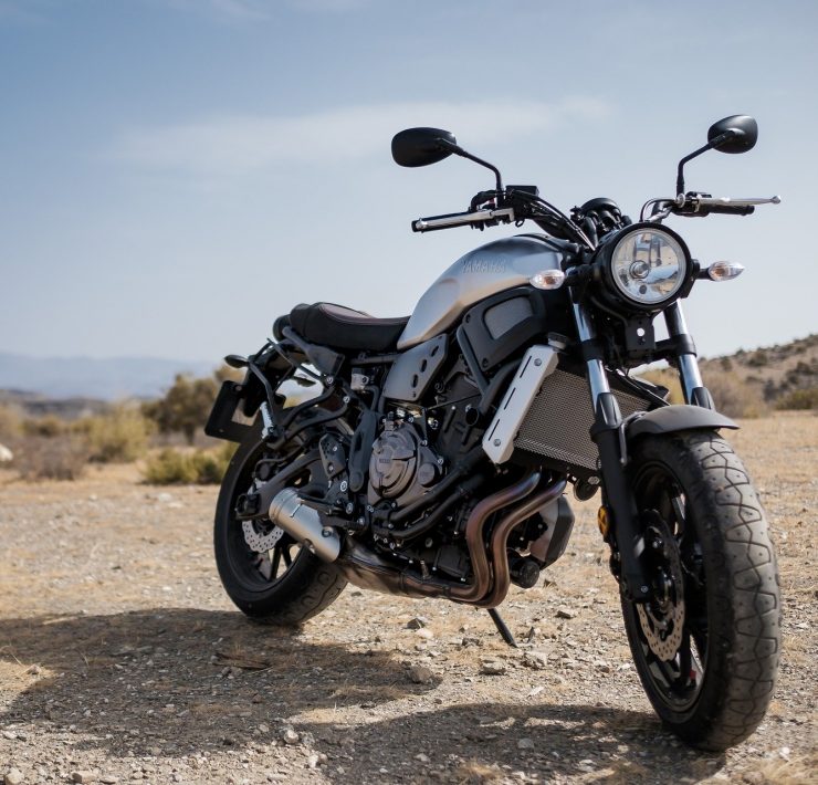 Motorbike parked on a dirt road