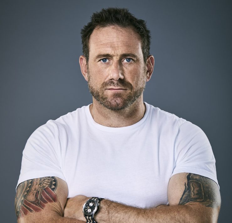 Jason Fox stood with folded arms