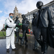 spraying the beatles statue in front of liver building