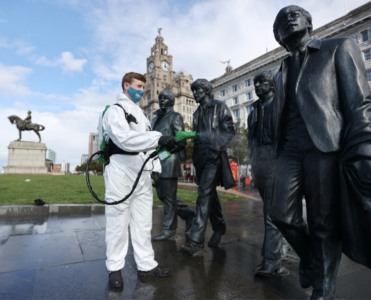 spraying the beatles statue in front of liver building
