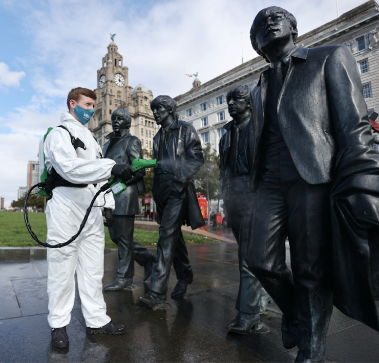 spraying the beatles statue in front of liver building