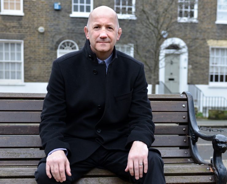 Geoff Thompson sat on a bench