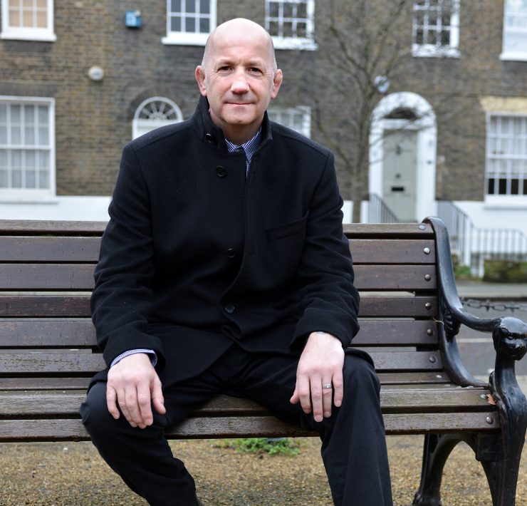 Geoff Thompson sat on a bench