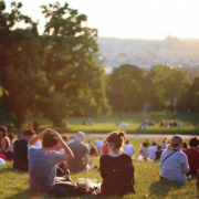 Groups of people sat in a park
