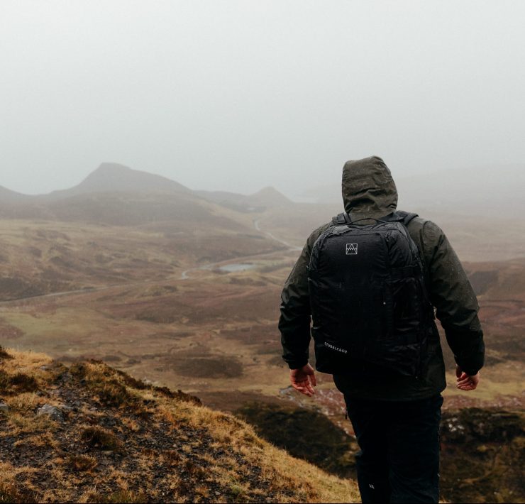 Stubble & Co bag worn by man on a misty mountian