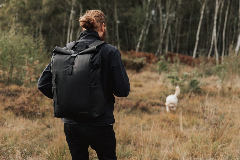 Stubble & Co bag worn by man walking in the woods