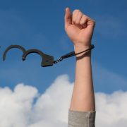 Person throwing off their handcuffs