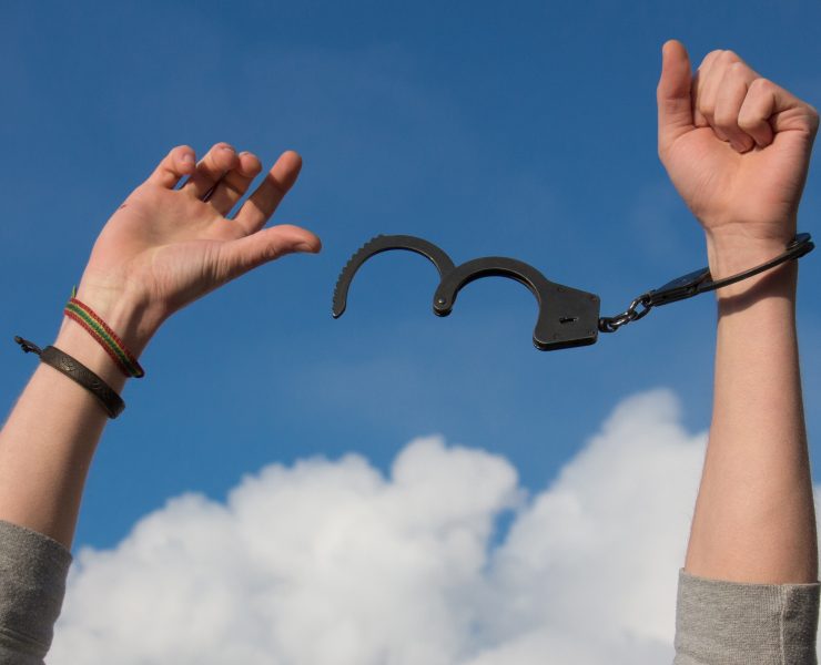 Person throwing off their handcuffs