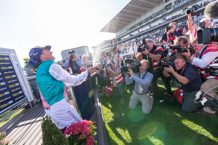 Jockey celebrating St Leger win at Doncaster racecourse