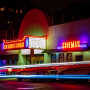 Neon lit movie theatee
