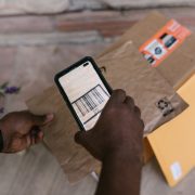 Courier scanning a parcel's barcode