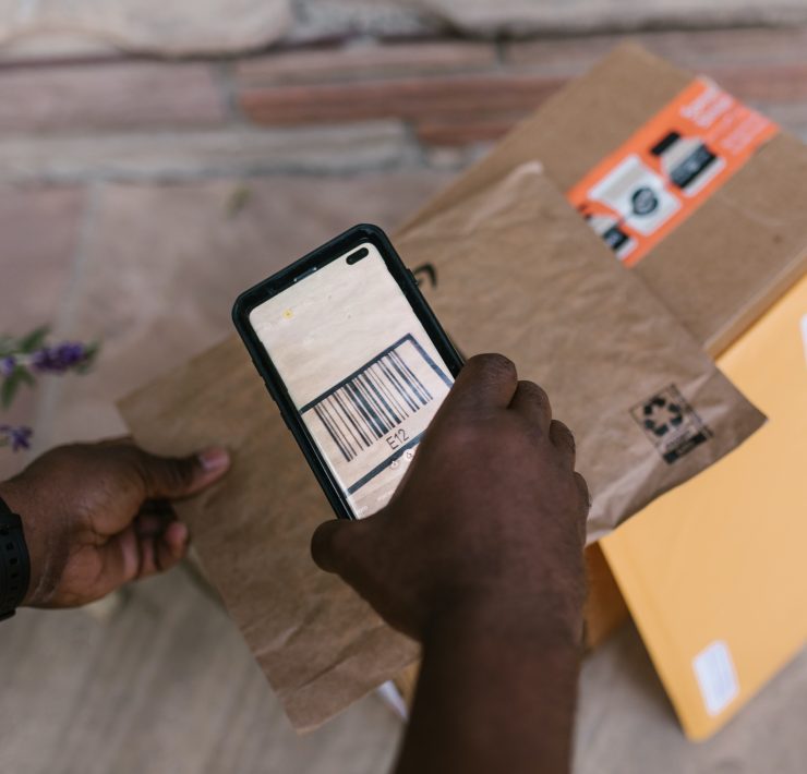 Courier scanning a parcel's barcode