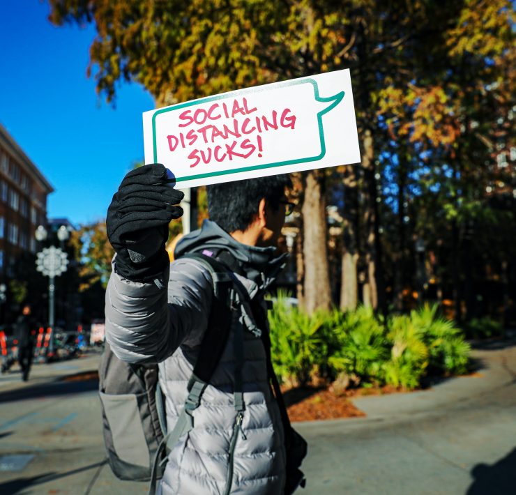 Social distancing sucks sign