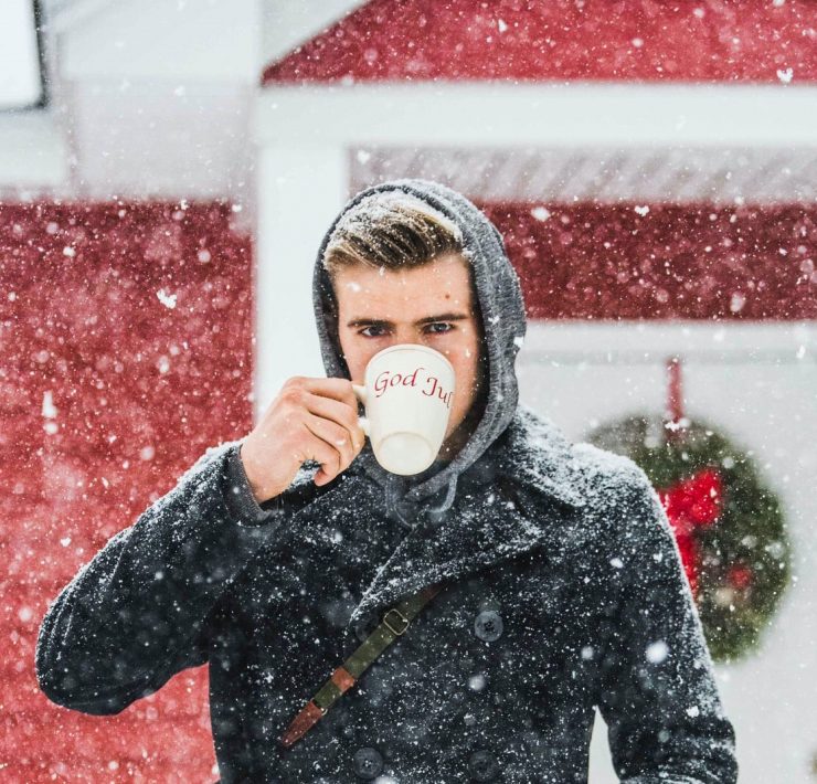Man drinking tea in the snow