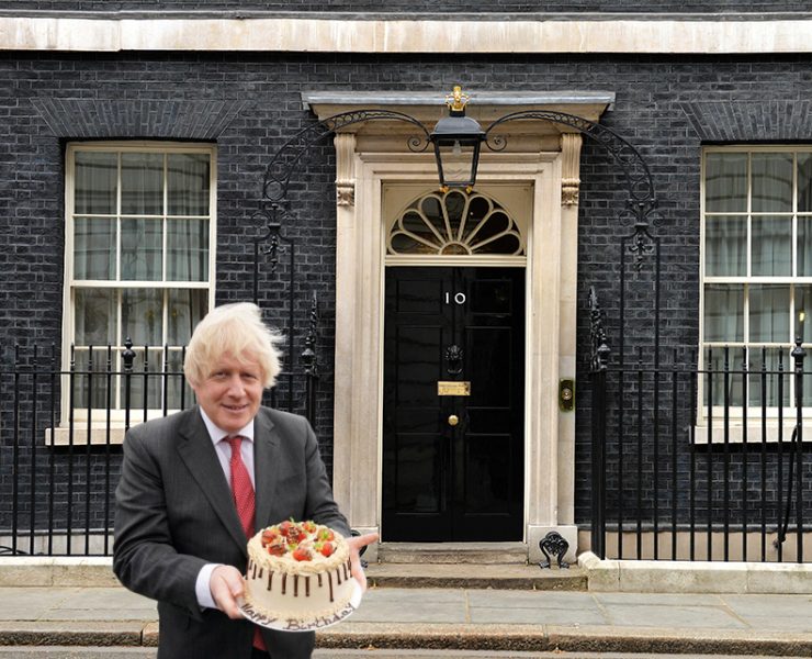 boris johnson holding a cake outside downing street