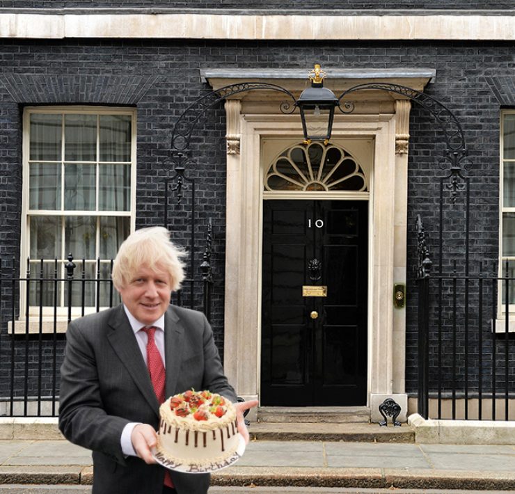 boris johnson holding a cake outside downing street
