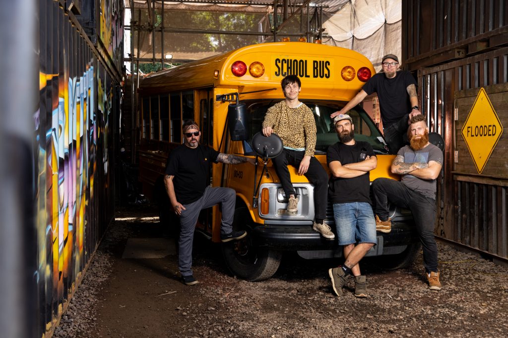 From left: Paul, Scotty, Jim, Ben & Ben with the transformed school bus from Full Metal Junkies