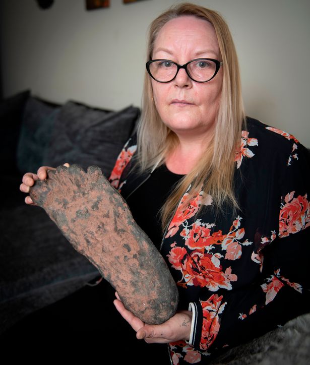 Deborah Hatswell with a Bigfoot footprint