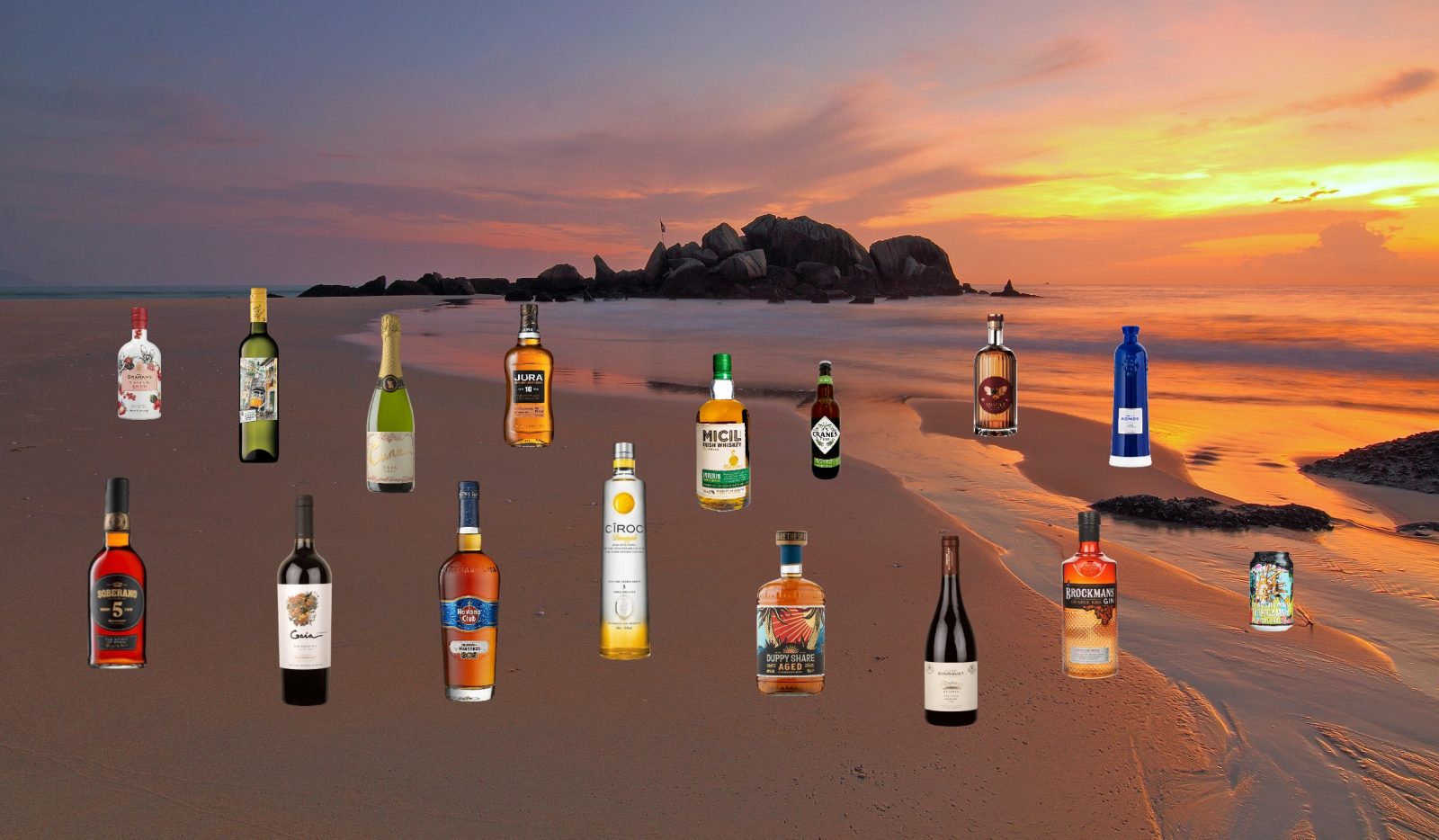 booze bottles on a beach with sunset backdrop