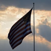 American flag against a sunset