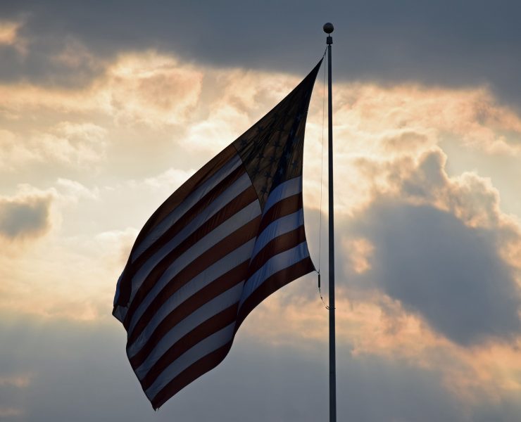 American flag against a sunset