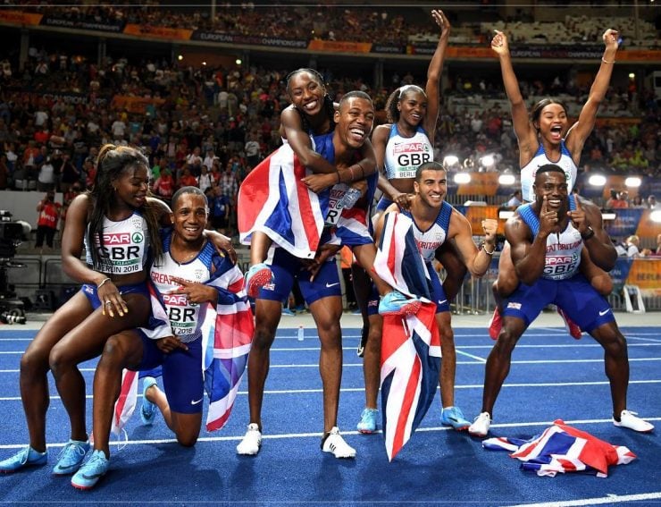 Team GB's sprinters celebrate after a double relay gold in Berlin 2018