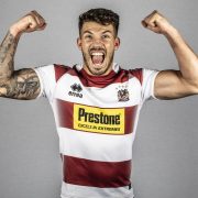 Wigan Warriors player Oliver Gildart flexing his biceps