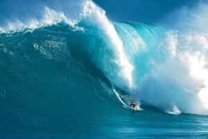 Laird Hamilton riding a huge wave