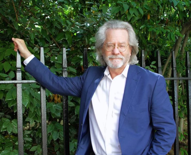 AC Grayling leaning on an iron fece