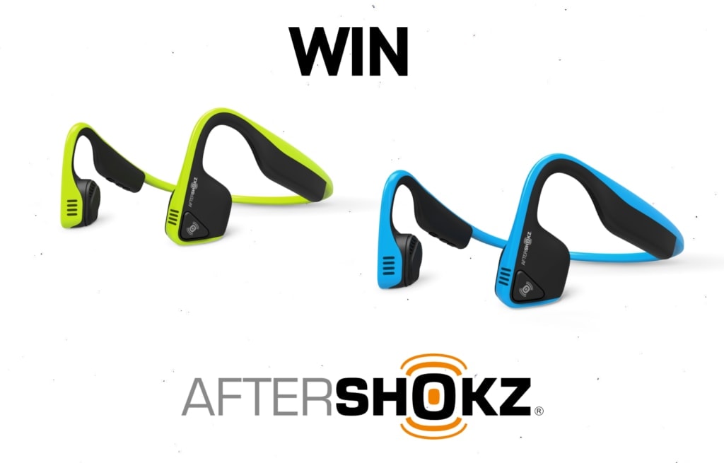 A yellow and blue set of Aftershokz earbuds