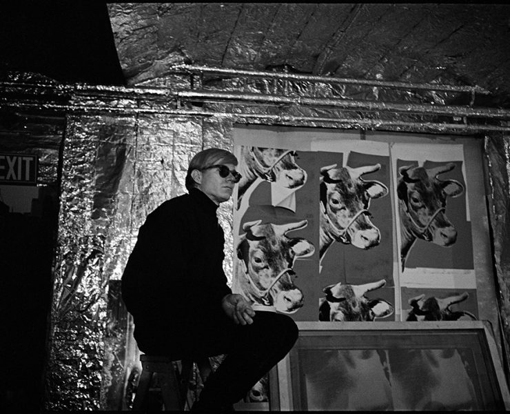 Andy Warhol with Cow Wallpaper at the factory from In and Out of Warhol’s Orbit: Photographs by Nat Finkelstein