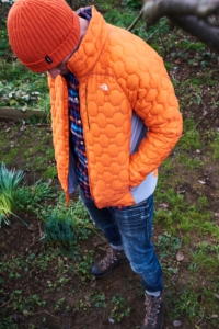 A man wearing a North FaceMen's Impendor Thermoball Jacket and Finisterre beanie